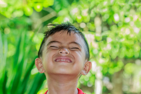 Closeup cute portrait of Asian little boy smiling
