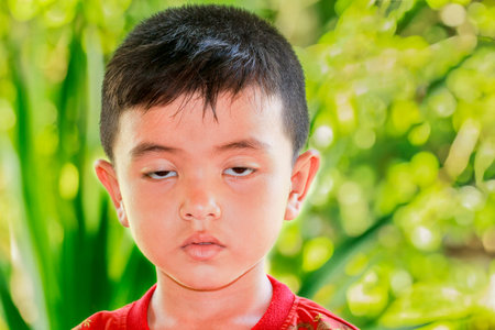Closeup cute portrait of Asian little boyの写真素材