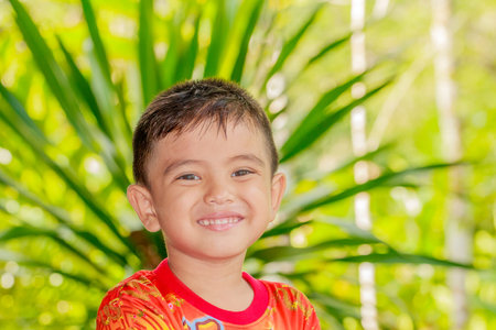 Closeup cute portrait of Asian little boy smiling