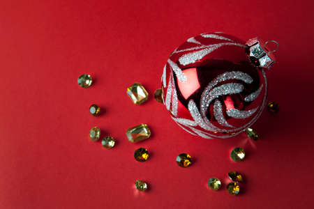 Christmas toys and diamonds on red backgroundの写真素材