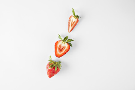 Strawberry isolated on white background on diagonal, fruits summerの写真素材