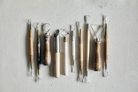 Ceramic working process with clay and tools for hand-crafted work. Pattern from aboveの写真素材