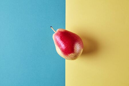 Whole fresh ripe pear, fruit view from above on green yellow background, modern style food picture, wallpaper designの写真素材