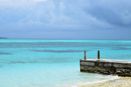 Dock surrounded by aqua blue waters of the Caribbeanの写真素材