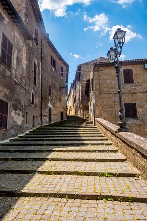 A staircase in the center of Grotte di Castro, a village in the province of Viterbo, Lazio, Italyの写真素材