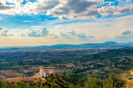 Panorama of the Spoleto plain and the Basilica of San Francesco from the Rocca Maggiore in Assisi, Umbria, Italyの写真素材