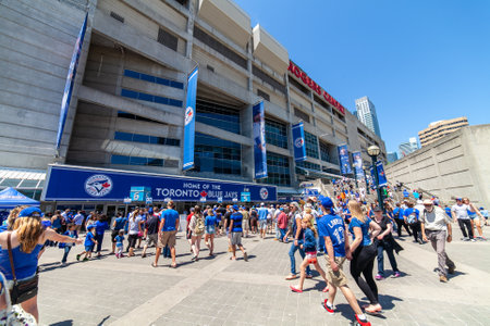 Outside Roger Center in Toronto, Ontario, Canada, in a baseball match day with blue Jays fan enteringのeditorial素材