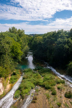 View of the turquoise waters of the Elsa River in the Elsa River Park, Colle Val d'Elsa, Tuscany, Italyの写真素材