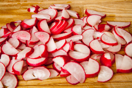 Fresh Sliced Radishes On A Wooden Boardの写真素材