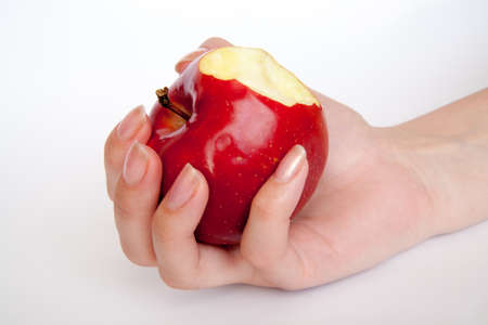human hand with apple isolate on whit backgroundの写真素材