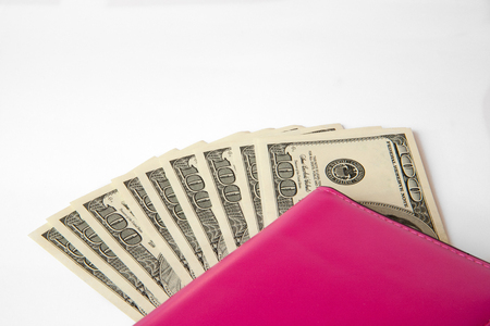 Money in female red leather purse isolated on white backgroundの写真素材