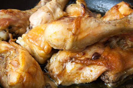 juicy and delicious fried chicken in a panの写真素材