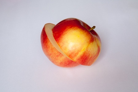 beautiful, consciously and tasty cut apple on a white backgroundの写真素材