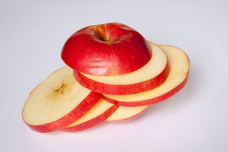 beautiful, consciously and tasty cut apple on a white backgroundの写真素材