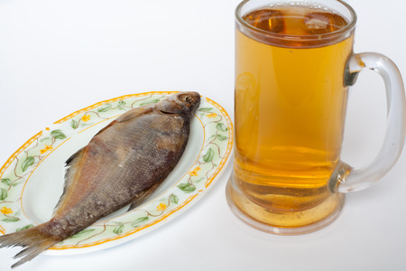 glass of light beer with the fish.isolated on a white background