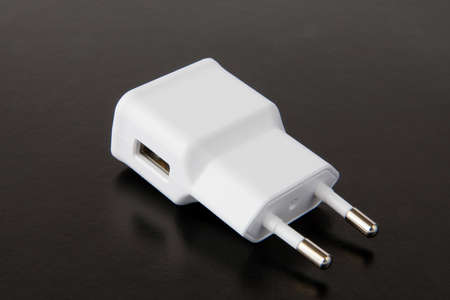 Macro White mobile charger isolated on white background