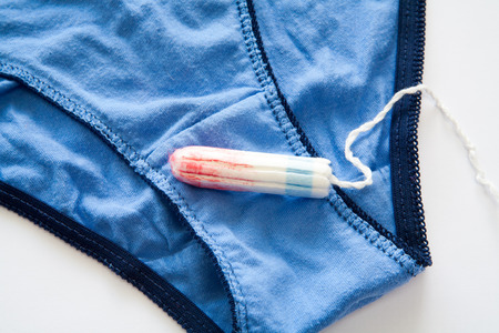 Woman hygiene protection closeup.menstruation calendar with cotton tampons
