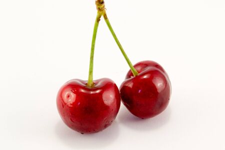 tasty and juicy cherries isolated on a white backgroundの写真素材