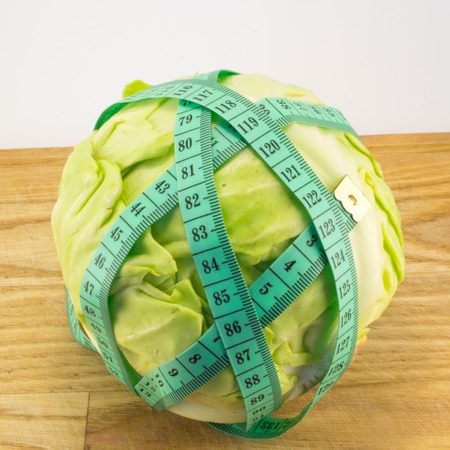 fresh cabbage wrapped meter on the boardの写真素材