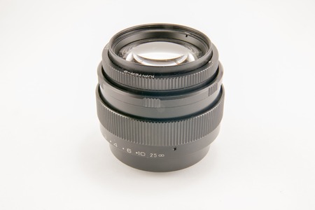 Black camera lens isolated on white background