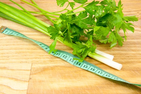 Mixed fresh vegetables on the plate on the boardの写真素材