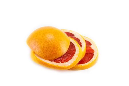 Juicy and tasty sliced greyafrut on a white backgroundの写真素材