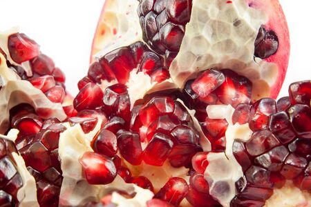 Juicy pomegranate fruit isolated on white backgroundの写真素材