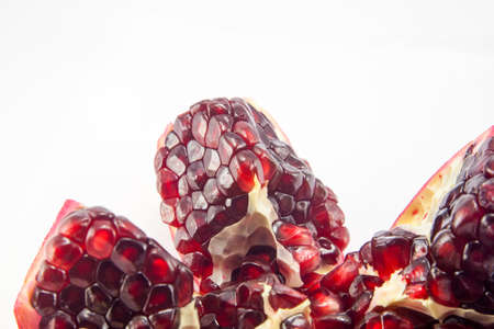 Juicy pomegranate fruit isolated on white backgroundの写真素材