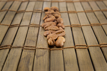 Coffee beans on vintage wooden board. Top imageの写真素材