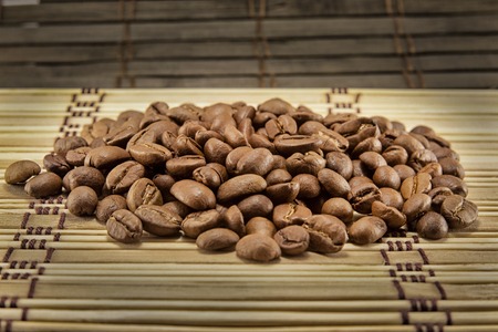 Coffee beans on vintage wooden board. Top imageの写真素材