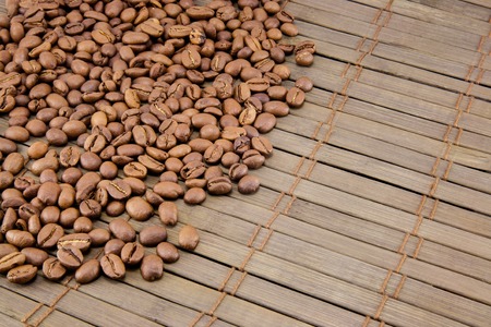 Coffee beans on vintage wooden board. Top imageの写真素材