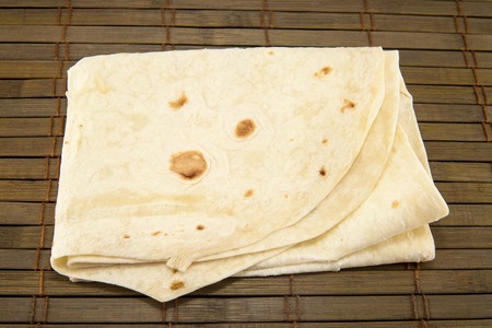 Large thin pita bread, isolated on a vintage backgroundの写真素材