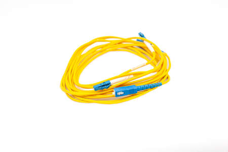 Yellow fiber optic cable isolated on white background