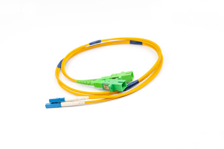Yellow fiber optic cable isolated on white background