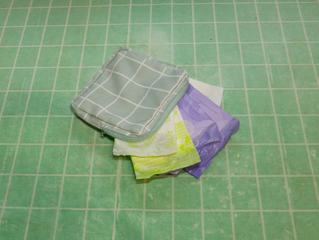 Turquoise cosmetic bag with pads and hygiene products