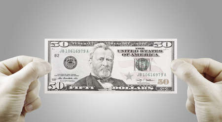 female hands with dollars isolated on a white
