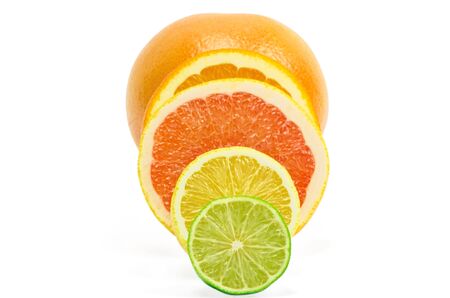 Vitamin C Overload, Stacks of sliced fruit isolated on whiteの写真素材