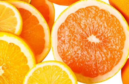 Vitamin C Overload, Stacks of sliced fruit isolated on whiteの写真素材
