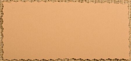 Old paper tag on natural burlapの写真素材