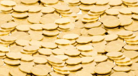 golden coins isolated on whiteの写真素材