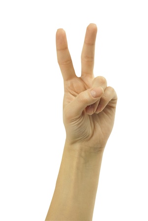 Hand with two fingers up in the peace or victory symbol  Also the sign for the letter V in sign language  Isolated on white の写真素材