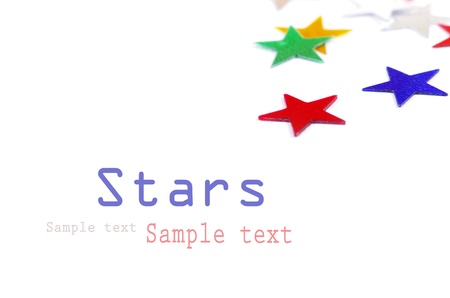 Christmas decoration of colored confetti stars against white background