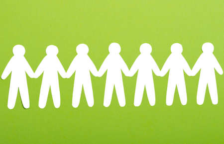 team of paper people on green backgroundの写真素材