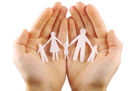 Paper family in hands isolated on white backgroundの写真素材