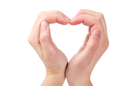 Two hands form a heart shape with their fingersの写真素材