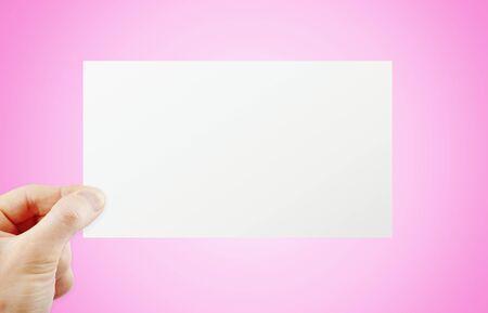 Hand holding paperの写真素材