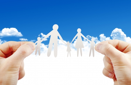 paper family in handsの写真素材