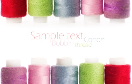 bobbins of thread isolated on whiteの写真素材