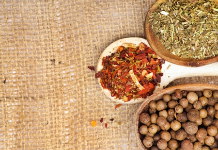 Colorful spices on burlapの写真素材