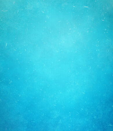 abstract blue background or dark paper with bright center spotlight and black vignette border frame with vintage grunge background texture black paper layout design of light blue graphic artの写真素材